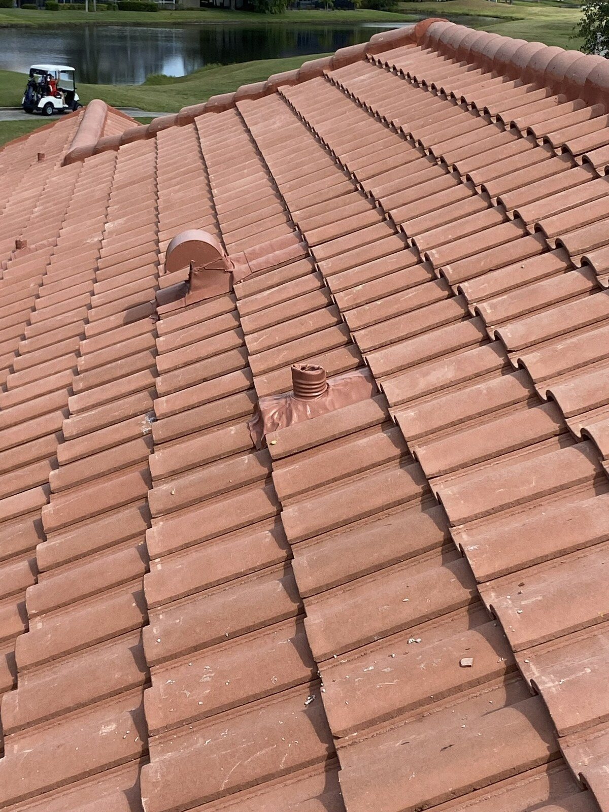 Concrete tile roofing with completed ridge and flashing details