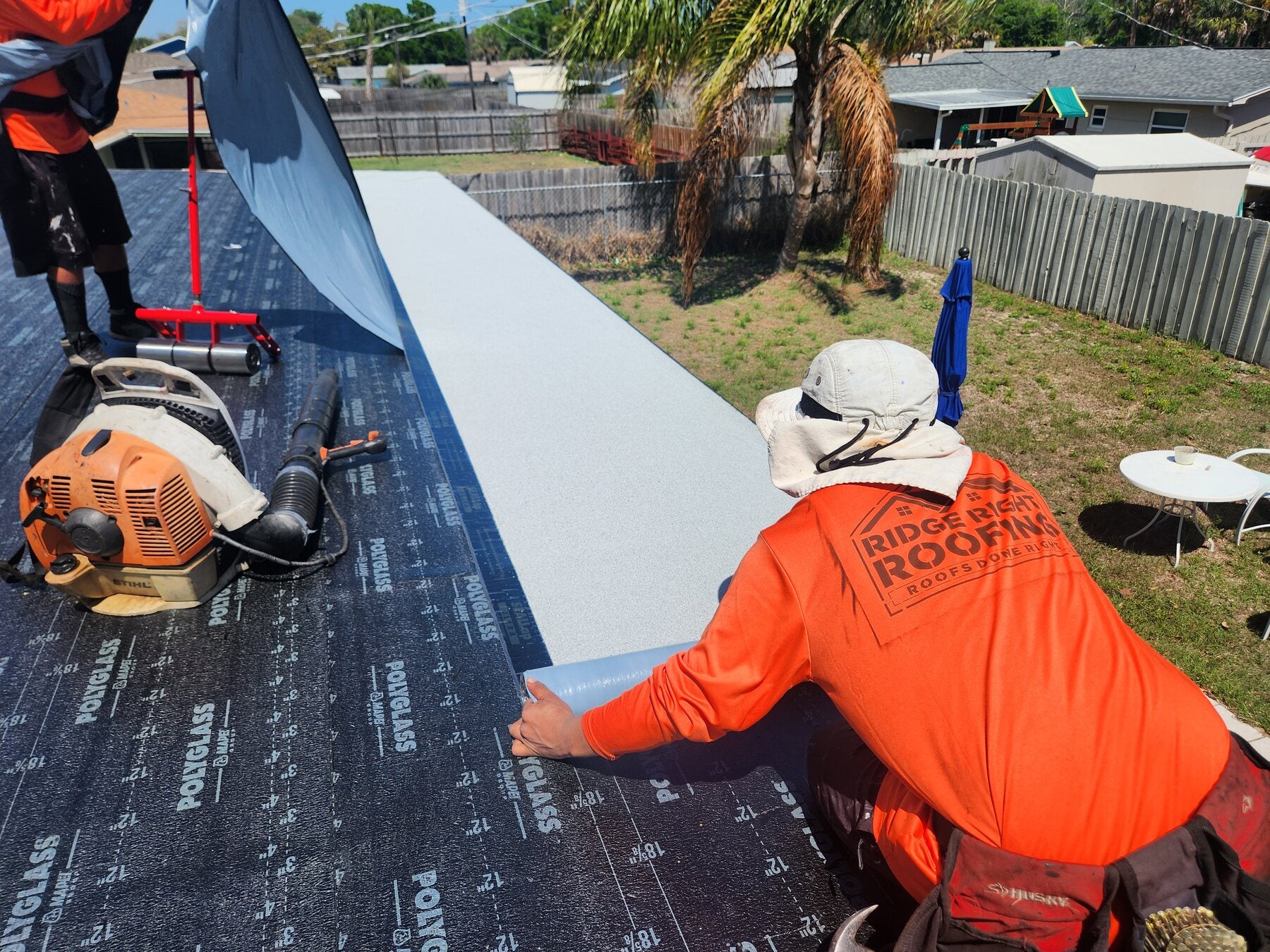 Ridge Right crew installing a roofing system by Ridge Right Roofing