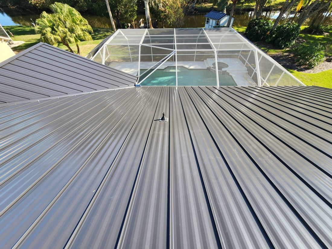 Metal roof overlooking a screened pool